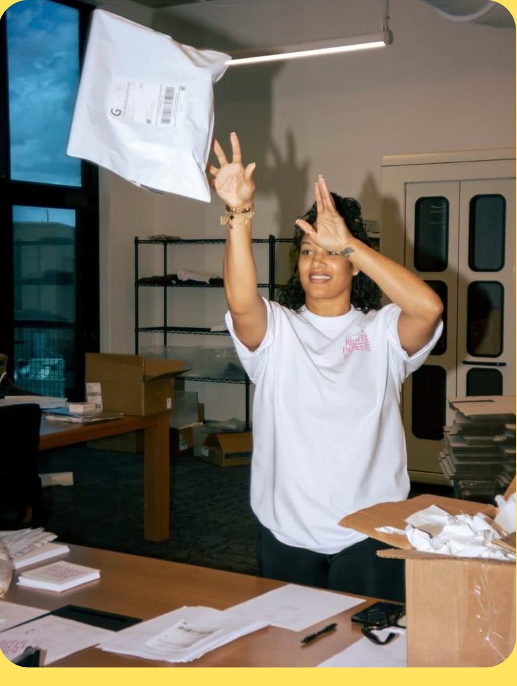 A merchant tossing a return parcel in her studio